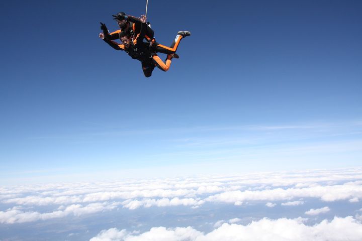 Sky diving above the clouds