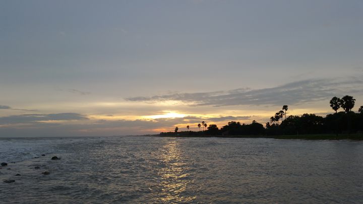 Sun rising on the beach